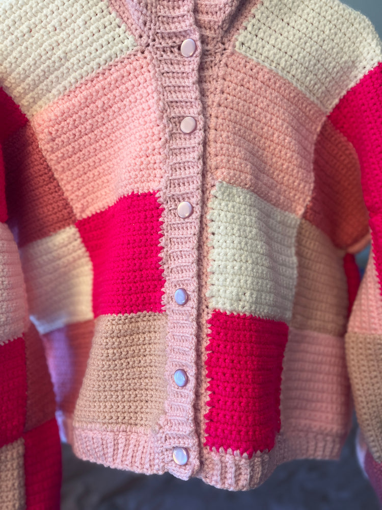 Close-up of crochet stitches and buttons